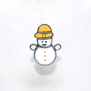 Bonhomme de neige jaune suspendu